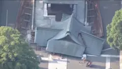 The roof of a temple is destroyed due to an earthquake.