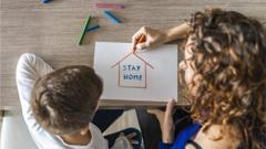 child-and-mother-drawing-stay-home-sign