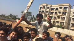 Pranav Dhanawade's teammates celebrating his achievement
