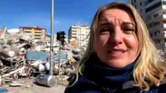 Anna Foster standing in front of demolished building