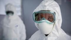 A health worker is seen wearing Personal Protective Equipment (PPE) during a rehearsal at the Bwera General Hospital close to Uganda's border with DR Congo in December 2018.