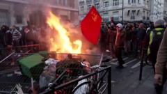 Protesters burn bins in street in Paris
