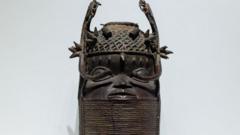 A 'Memorial Head' (Unhunmwun elau, from Nigeria, Benin Kingdom, collected in Nigeria and acquired 1898) is displayed as part of an exhibition on the 'Benin Bronzes' during a press preview of new exhibition halls ahead of their opening in the east wing of the new Berlin Palace Humboldt Forum in Berlin on September 15, 2022