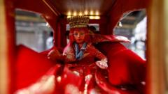 An idol of the Living Goddess Kumari is pictured inside the miniature chariot kept on display during the annual festival of Indra Jatra which is cancelled due to the spread of the coronavirus disease (COVID-19) in Kathmandu, Nepal September 2, 2020