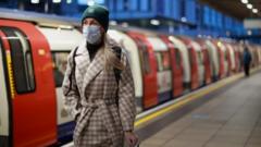 A person wears a face mask on the London underground, as the spread of the coronavirus disease (COVID-19) continues in London, Britain, November 30, 2021