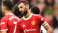 Manchester United's Bruno Fernandes reacts after missing a penalty against Aston Villa