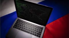 laptop with russian flag behind