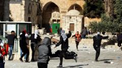 Palestinians clash with Israeli police in the al-Aqsa Mosque compound on 22 April 2022