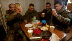 Ukrainian troops toast each other