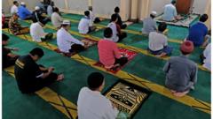 Muslims pray while practicing social distancing inside a mosque amid the spread of the coronavirus disease in Temanggung, Central Java province, Indonesia