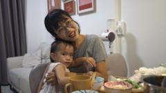 Tran Nguyen Kim Ngan with her toddler