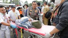 Rescuers carry an injured victim of the earthquake at a hospital in Cianjur, West Java, Indonesia, 21 November 2022.