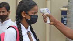 Schoolgirl in Colombo being thermally scanned