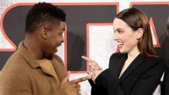 John Boyega and Daisy Ridley attend the 'Star Wars: The Last Jedi' photocall at Corinthia Hotel London on December 13, 2017 in London, England.