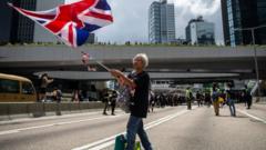 A woman holds a UK flag during a protest in Hong Kong in 2019