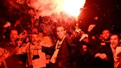 Australia fans celebrate with a flare in Melbourne