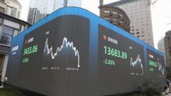 An electronic screen displaying the the Shanghai Composite Index, the Shenzhen Component Index and the Hang Seng Index is seen on the street on January 25, 2022 in Shanghai, China.
