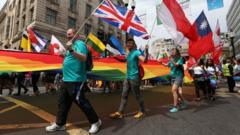 People take part in the Pride in London Parade in central London