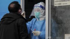 A man undergoes COVID-19 nucleic acid testing in Beijing, China