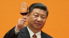 President Xi Jinping raises a glass of wine from a podium, set against a yellow background, in this photo
