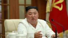 Kim Jong-un chairs a meeting on 25 Aug