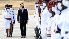 Prince Edward, Earl of Wessex inspects the Guard of Honour as he arrives at VC Bird International Airport on April 25, 2022 in St John's, Antigua and Barbuda.