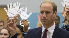 Prince William holds up a hand which shows who he'd turn to if he were bullied