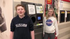 Kids with a reverse vending machine in Norway