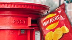 A Walkers crisp packet next to a post box