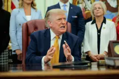 US President Donald Trump speaks to the media after signing an executive order establishing the President's Military Spouse Commission in the Oval Office at the White House on August 03, 2026 in Washington, DC. 