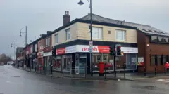 Photograph of the Re:dish Good Stuff social supermarket in Stockport. The image is taken on Gorton Road in Reddish.