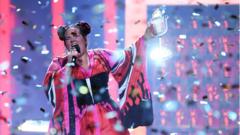 Israel's singer Netta Barzilai aka Netta performs with the trophy after winning the final of the 63rd edition of the Eurovision Song Contest 2019