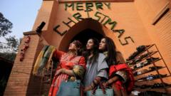 In Peshawar, Pakistan, young Christian women take selfies before a Christmas service