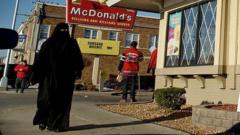 A woman walks past McDonald's in Hamtramck, Michigan
