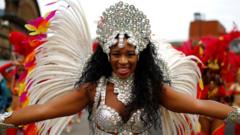 Revellers take part in the Notting Hill Carnival in London