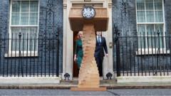 Liz Truss leaves Number 10 Downing Street with her husband Hugh O'Leary on her last day in office as British Prime Minister.