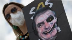 A woman holds a poster with an image representing the President of Brazil, Jair Bolsonaro, painted as a skull, during a demonstration rejecting the handling of the pandemic by his Government, in Brasilia, Brazil, 20 October 2021.