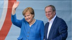 Christian Democratic Union (CDU) party chairman and top candidate for the upcoming federal elections Armin Laschet (R) and German Chancellor Angela Merkel (L) during the election campaign closing of the CDU in Aachen, Germany, 25 September 2021
