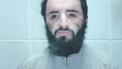 A custody shot of Abu Faraj al-Libi