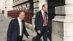 PA Media Dominic Raab and Philip Barton