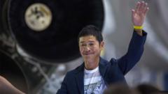 Japanese billionaire Yusaku Maezawa speaks near a Falcon 9 rocket during the announcement by Elon Musk to be the first private passenger who will fly around the Moon, 17 September 2018