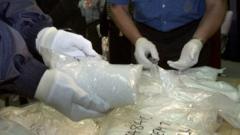 Australian police sort through seized drugs in December 2000