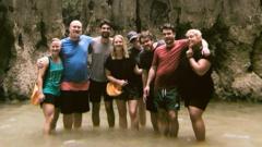 Group standing in water smiling