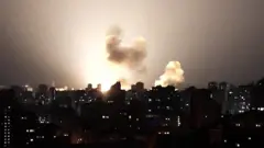 Ukraine skyline at night lit up by a missile
