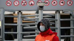 Stadium steward in a mask