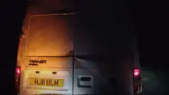 The van was captured being rammed into the police car before it crashed