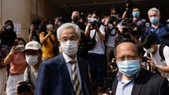 Democratic Party founder and barrister Martin Lee and Albert Ho arrive at the West Kowloon Courts for verdicts in landmark unlawful assembly case, in Hong Kong, China April 1, 2021. REUTERS/Tyrone Siu