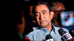In this photo taken on January 8, 2019 Maldives' former president Abdulla Yameen speaks to the media outside a police station where he had been questioned by investigators on money laundering allegations in Male. - Yameen was unexpectedly beaten to the presidency by Ibrahim Mohamed Solih in elections in September 2018, and had been earlier accused by critics of corruption and muzzling the media. (Photo by Ahmed SHURAU / AFP) (Photo credit should read AHMED SHURAU/AFP via Getty Images)