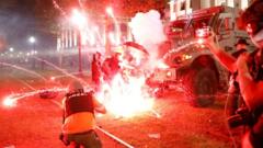Flares go off in front of a Kenosha Country Sheriff Vehicle as demonstrators take part in a protest following the police shooting of Jacob Blake in Kenosha, Wisconsin, on 25 August 2020