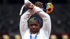 Shot-put silver medallist Raven Saunders of the United States gestures on the podium